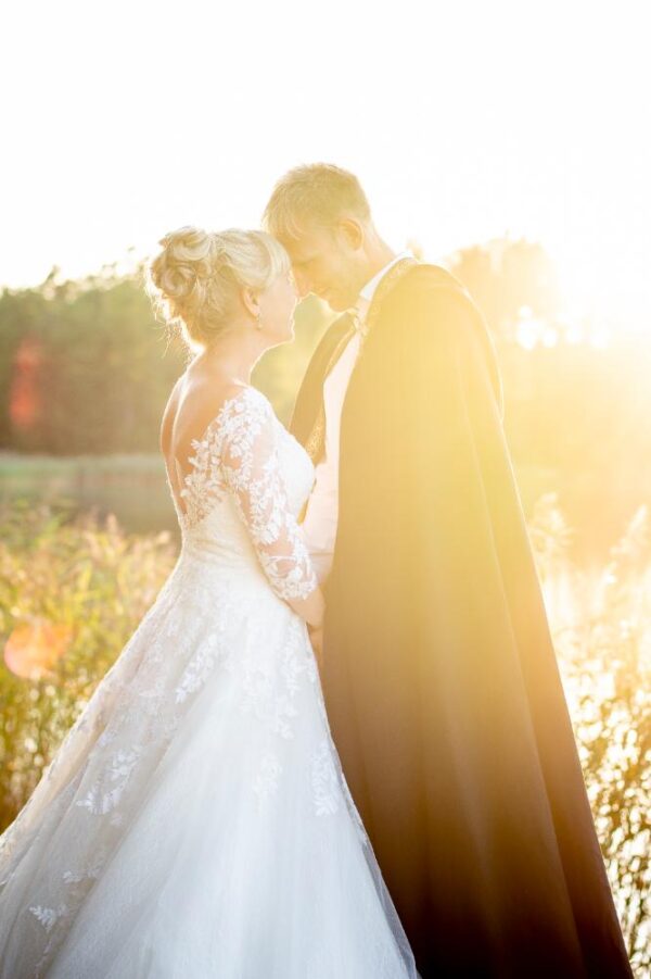 A wedding couple looking into each other’s eyes and an incredible light.