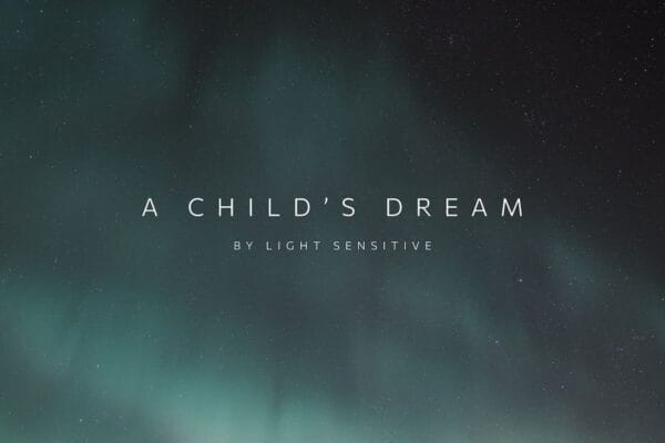 Text "A Child's Dream by Light Sensitive" appears over a dark night sky, where faint green and blue northern lights ripple in a timelapse effect above scattered stars in the background.